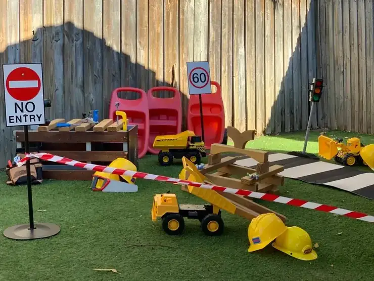 The outdoor playground sandpit, with diggers and buckets